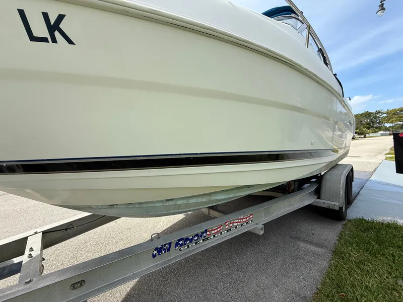 Slide: The Image of 2000 Wellcraft 2400 Martinique boat on trailer, side view. - 27