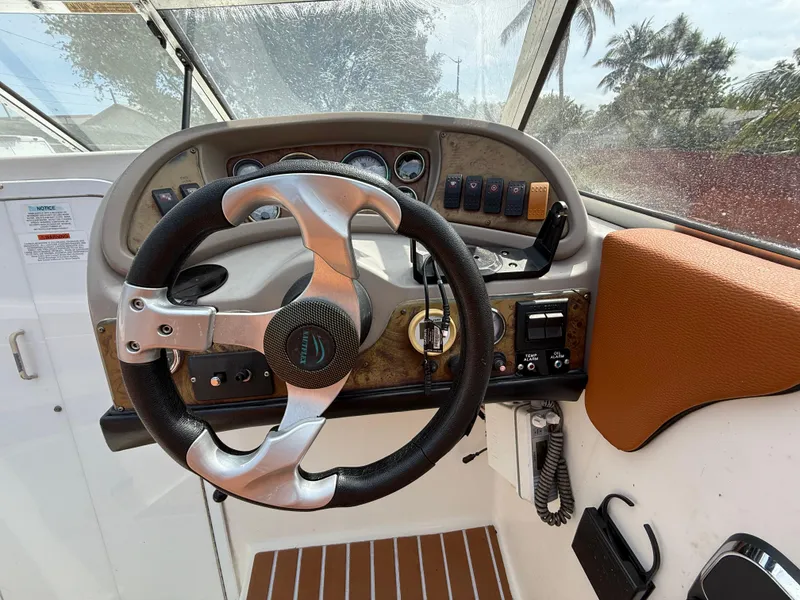 Slide: The Image of Steering wheel and dashboard of 2000 Wellcraft 2400 Martinique boat. - 41