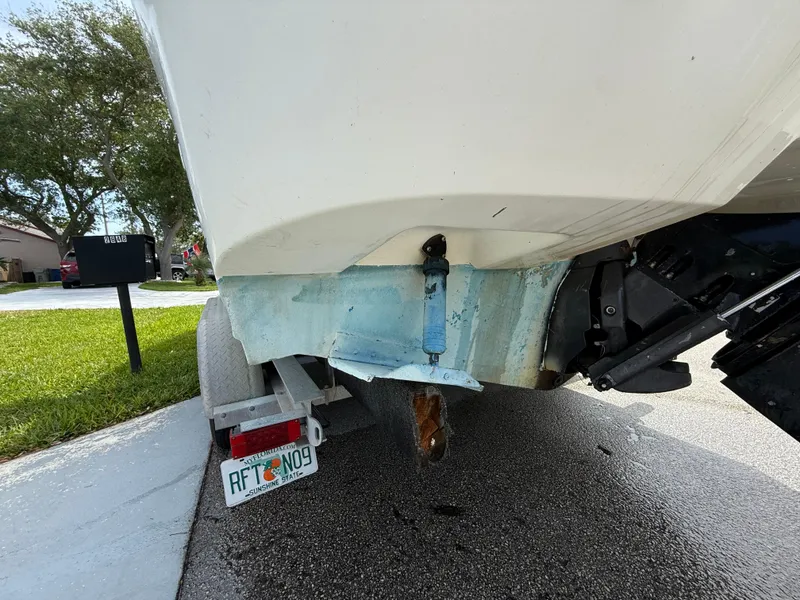Slide: The Image of 2000 Wellcraft 2400 Martinique boat on trailer, rear view, Florida license plate visible. - 5