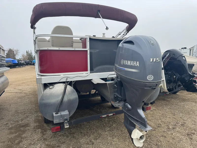 Slide: The Image of 2016 Bennington 22 SS pontoon boat with Yamaha 115 outboard motor, rear view. - 2