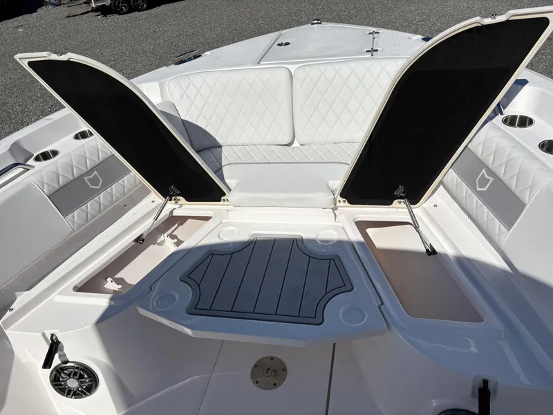 Slide: The Image of 2024 Sea Fox 268 Commander boat interior with open storage compartments and cushioned seating. - 12