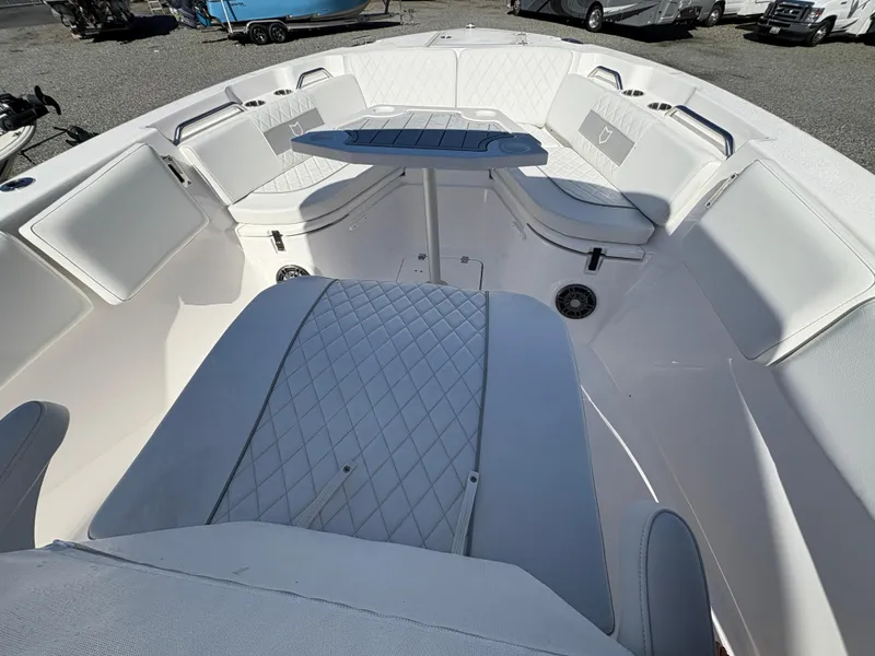 Slide: The Image of 2024 Sea Fox 268 Commander boat interior with cushioned seating and table. - 15
