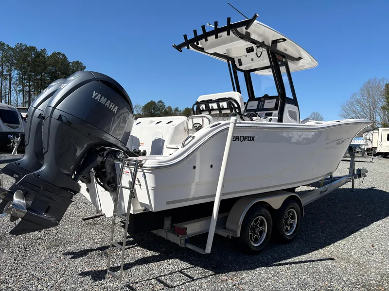 Slide: The Image of 2024 Sea Fox 268 Commander boat on trailer with Yamaha engine, parked outdoors. - 4