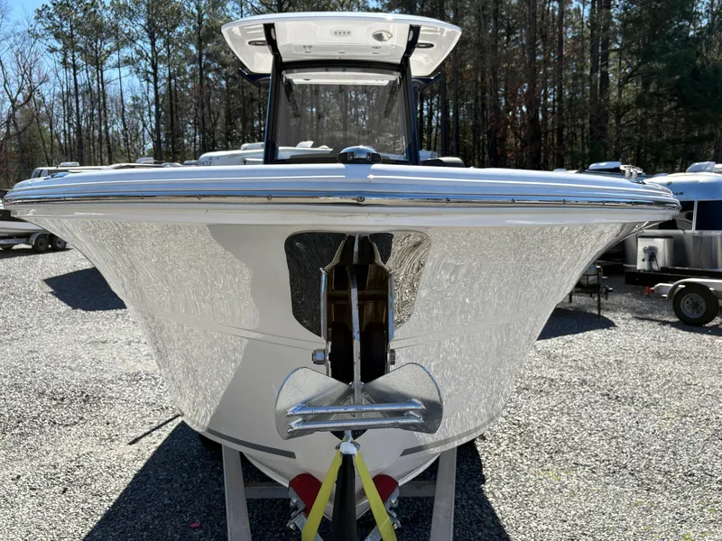 Slide: The Image of 2024 Sea Fox 268 Commander boat front view, displayed outdoors on gravel. - 6