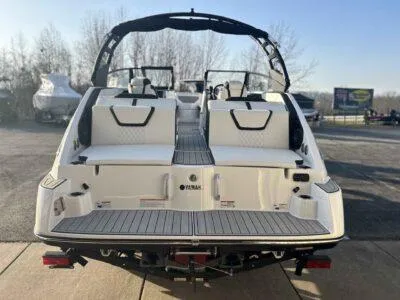 Slide: The Image of 2025 Yamaha Boats 222SD, rear view, docked, showcasing seating and deck design. - 6