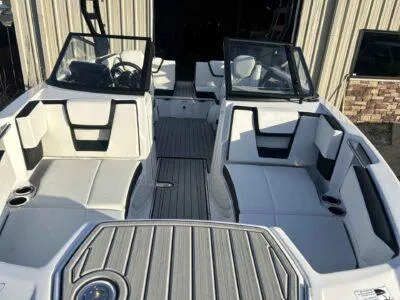 Slide: The Image of 2025 Yamaha Boats 222SD interior with sleek white seating and modern dashboard design. - 7