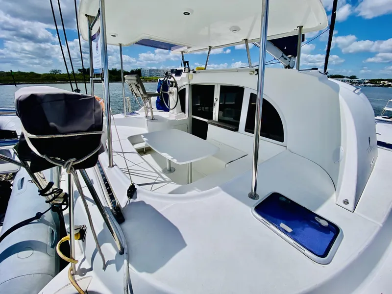Slide: The Image of Lagoon 380 S2 catamaran, 2014 model, featuring spacious deck and modern design on a sunny day. - 10
