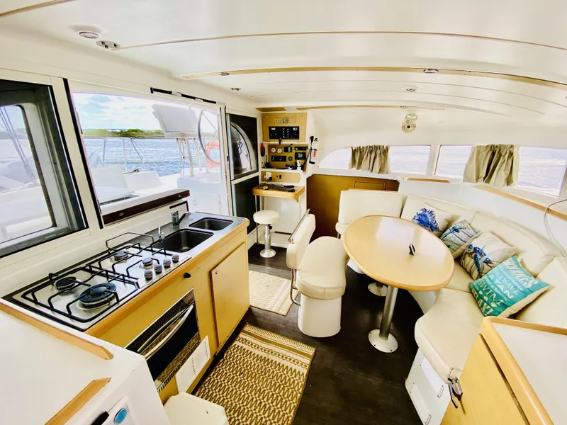 Slide: The Image of Interior of 2014 Lagoon 380 S2 catamaran with kitchen and dining area. - 17
