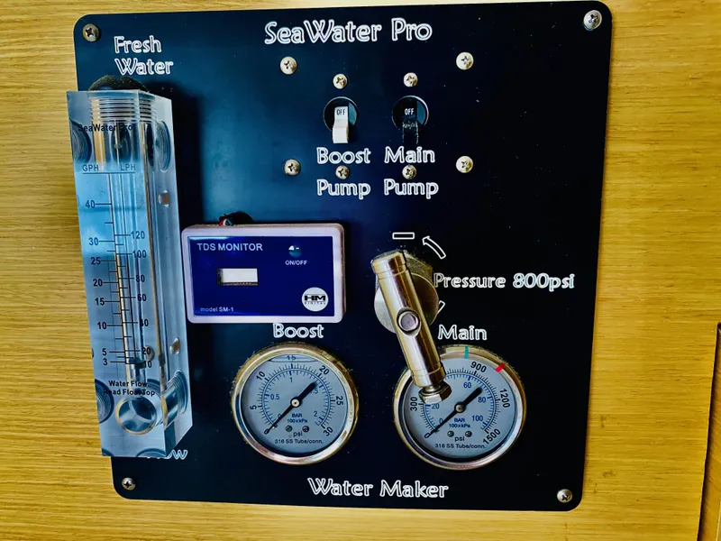 Slide: The Image of SeaWater Pro water maker control panel on Lagoon 380 S2, 2014 model, with gauges and switches. - 30