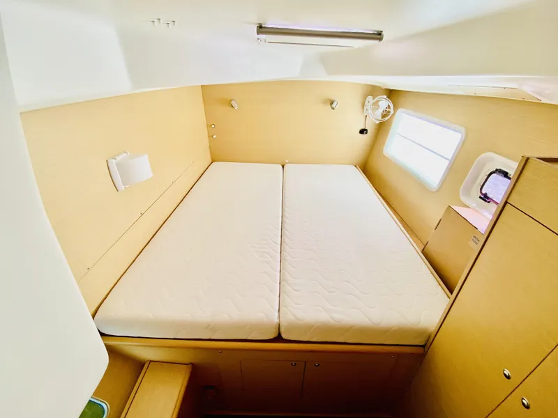 Slide: The Image of Interior cabin of 2014 Lagoon 380 S2 catamaran with double bed and window. - 32