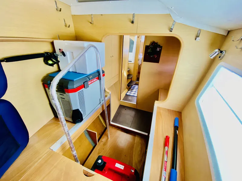 Slide: The Image of Interior of 2014 Lagoon 380 S2 yacht, featuring storage area and modern equipment. - 34