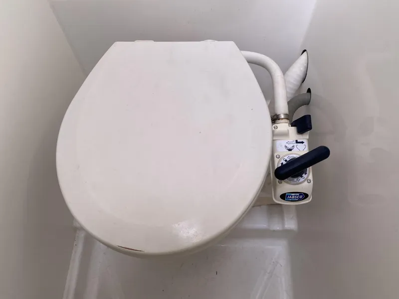 Slide: The Image of 2014 Lagoon 380 S2 marine toilet with manual pump handle. - 38
