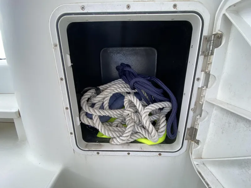 Slide: The Image of Storage compartment on a 2014 Lagoon 380 S2 with coiled ropes inside. - 40