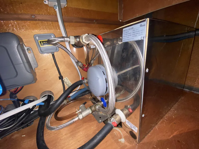 Slide: The Image of Under-sink plumbing and wiring in a 2014 Lagoon 380 S2 yacht. - 42