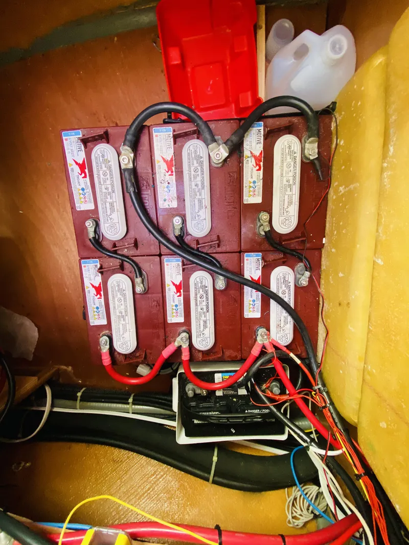 Slide: The Image of Battery compartment of a 2014 Lagoon 380 S2 catamaran with wiring connections. - 43