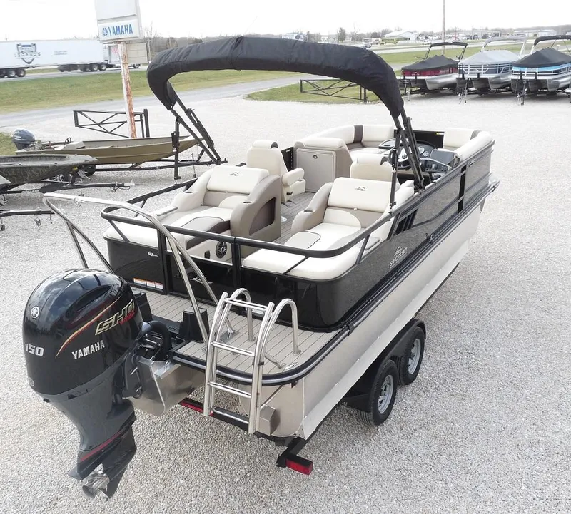 Slide: The Image of 2025 SunCatcher Select 322SS pontoon boat with Yamaha motor on trailer. - 1