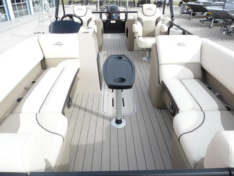 Slide: The Image of 2025 SunCatcher Select 322SS pontoon boat with spacious seating and modern interior design. - 11
