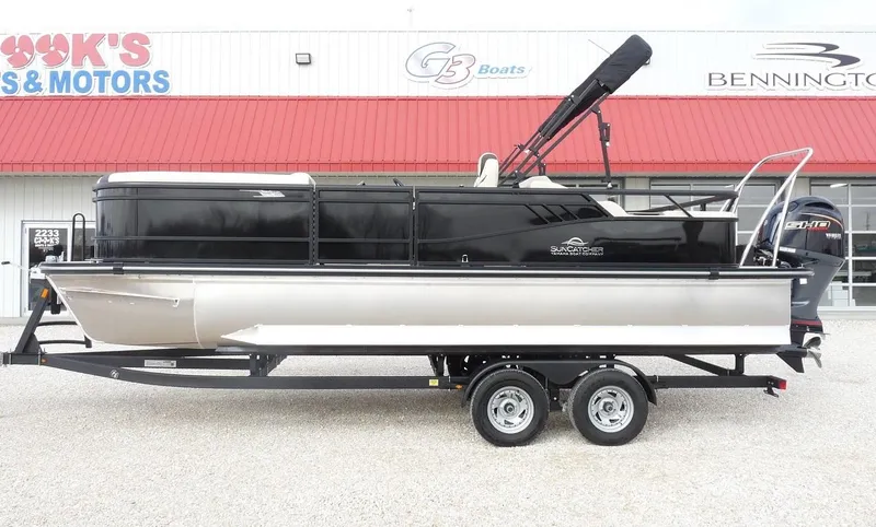 Slide: The Image of 2025 SunCatcher Select 322SS pontoon boat on trailer, parked outside dealership. - 5