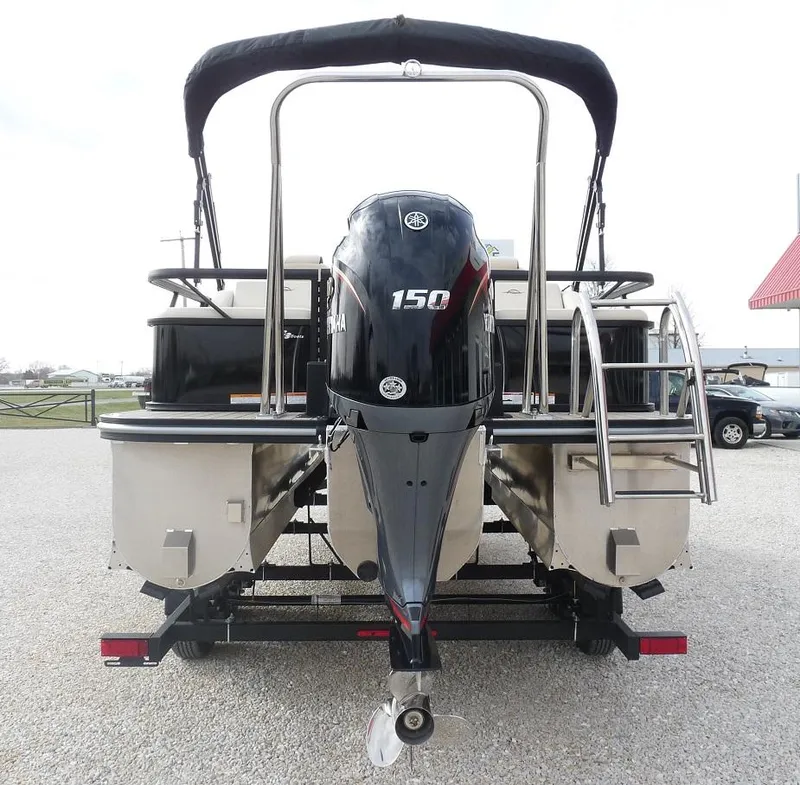 Slide: The Image of 2025 SunCatcher Select 322SS pontoon boat with Yamaha 150 engine, rear view. - 6