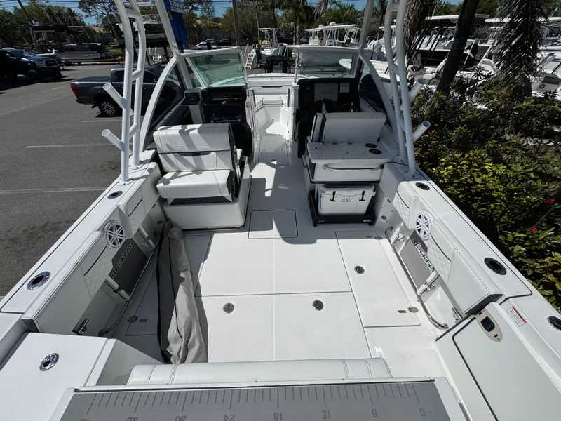 Slide: The Image of 2022 Blackfin 252 DC boat interior with seating and storage compartments. - 24
