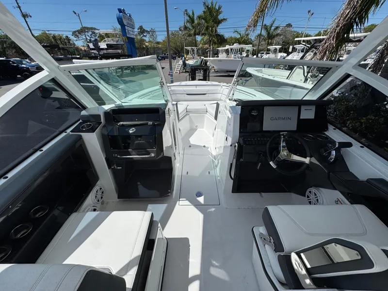 Slide: The Image of 2022 Blackfin 252 DC boat interior with modern dashboard and seating. - 31