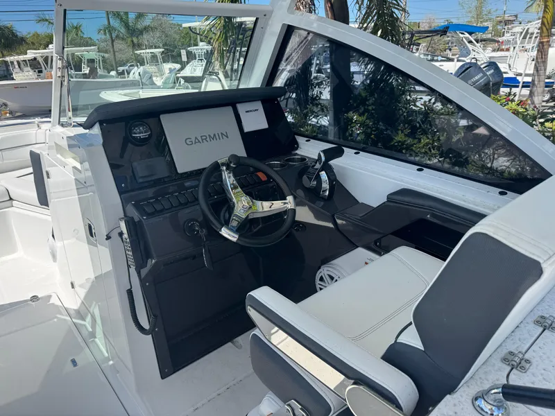 Slide: The Image of 2022 Blackfin 252 DC boat cockpit with Garmin navigation system and sleek seating. - 32