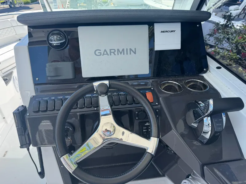Slide: The Image of Dashboard of 2022 Blackfin 252 DC boat with Garmin navigation system. - 33
