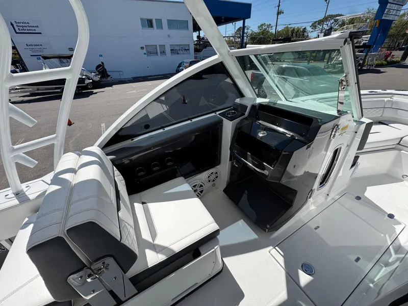 Slide: The Image of 2022 Blackfin 252 DC boat interior with modern helm and seating. - 34
