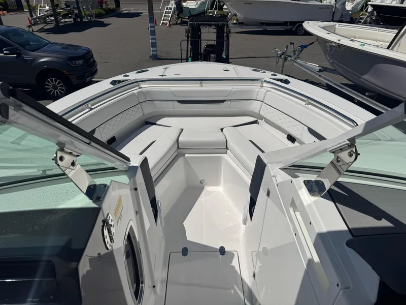 Slide: The Image of 2022 Blackfin 252 DC boat with open bow seating and sleek design. - 36