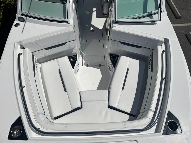 Slide: The Image of 2022 Blackfin 252 DC boat interior with white seating and open deck layout. - 38