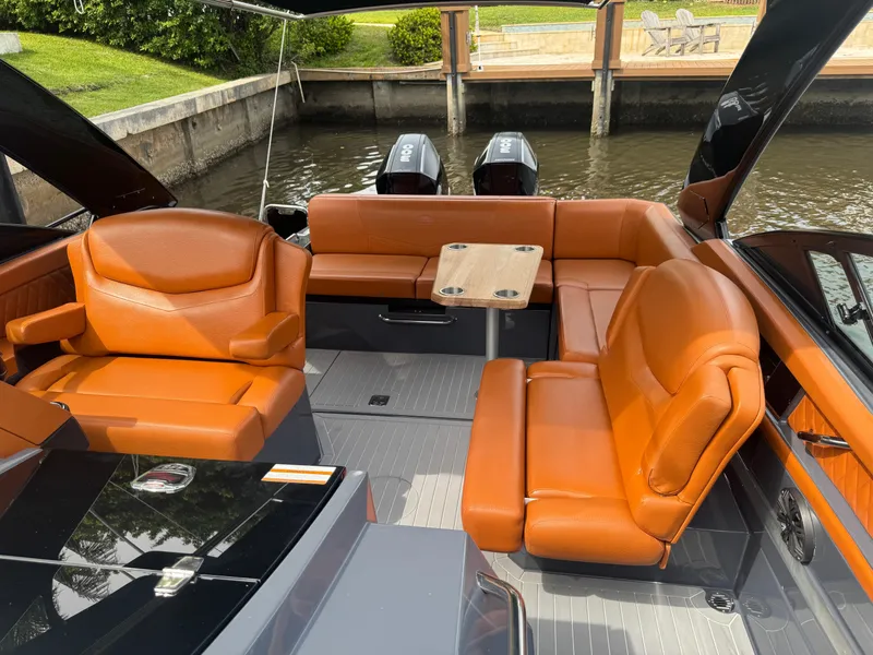 Slide: The Image of 2021 Cruisers Yachts 338 South Beach Edition Bow Rider with luxurious orange seating. - 18
