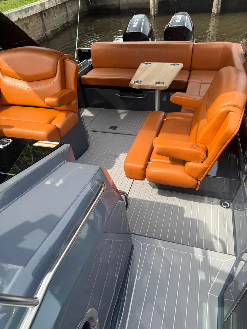 Slide: The Image of 2021 Cruisers Yachts 338 South Beach Edition Bow Rider with orange seating and sleek design. - 21