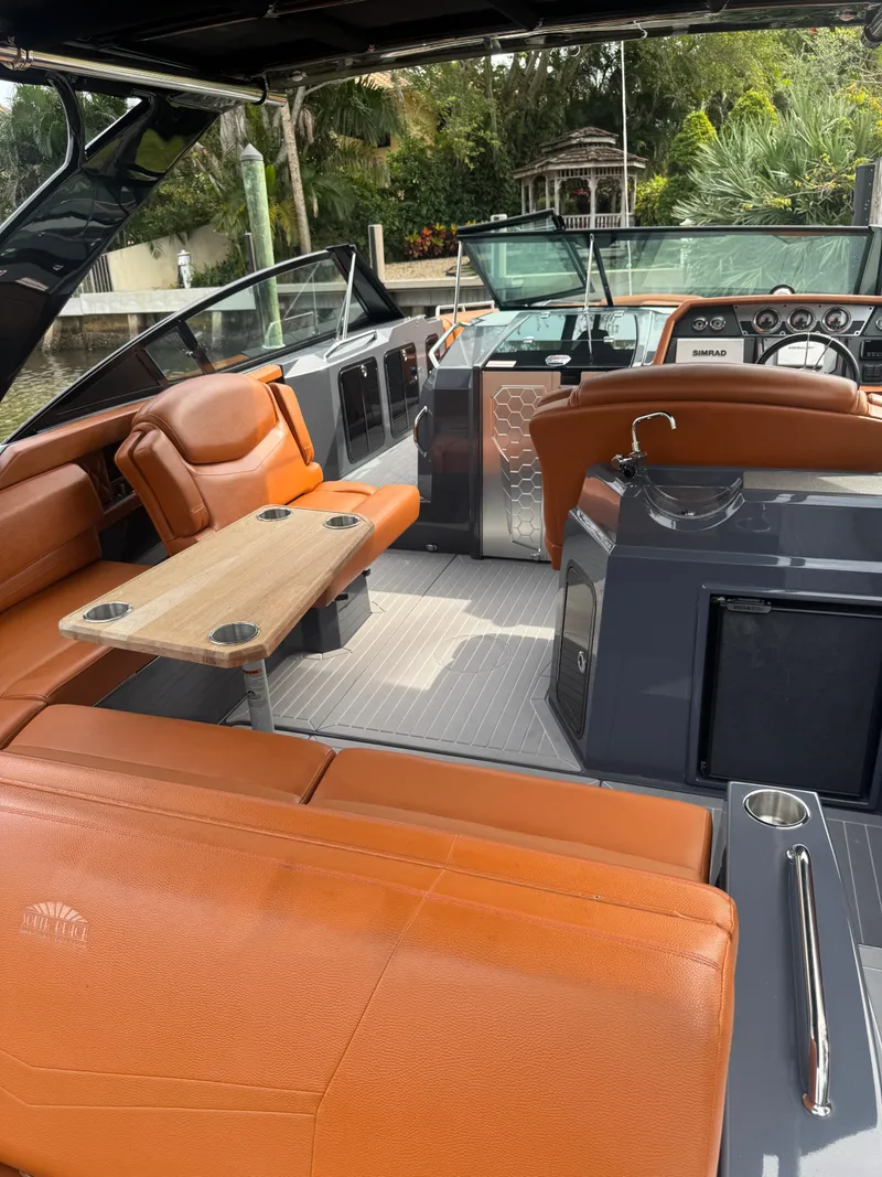 Slide: The Image of 2021 Cruisers Yachts 338 South Beach Edition Bow Rider with luxurious seating and modern interior design. - 23