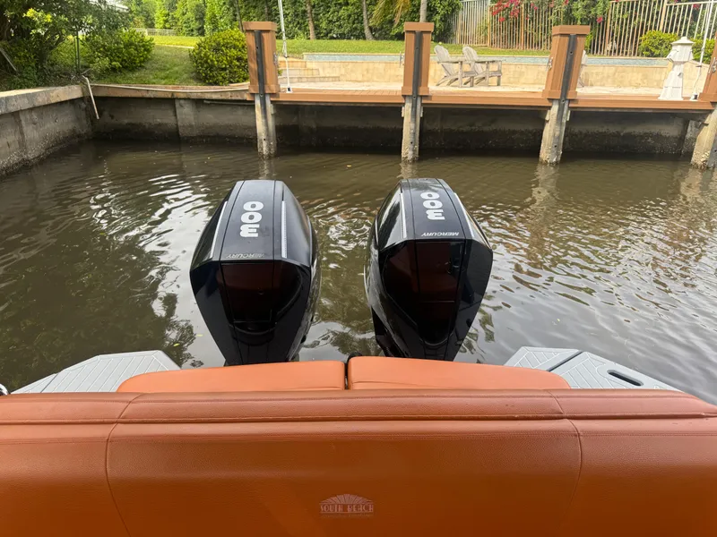 Slide: The Image of 2021 Cruisers Yachts 338 South Beach Edition Bow Rider with twin outboard engines docked. - 27