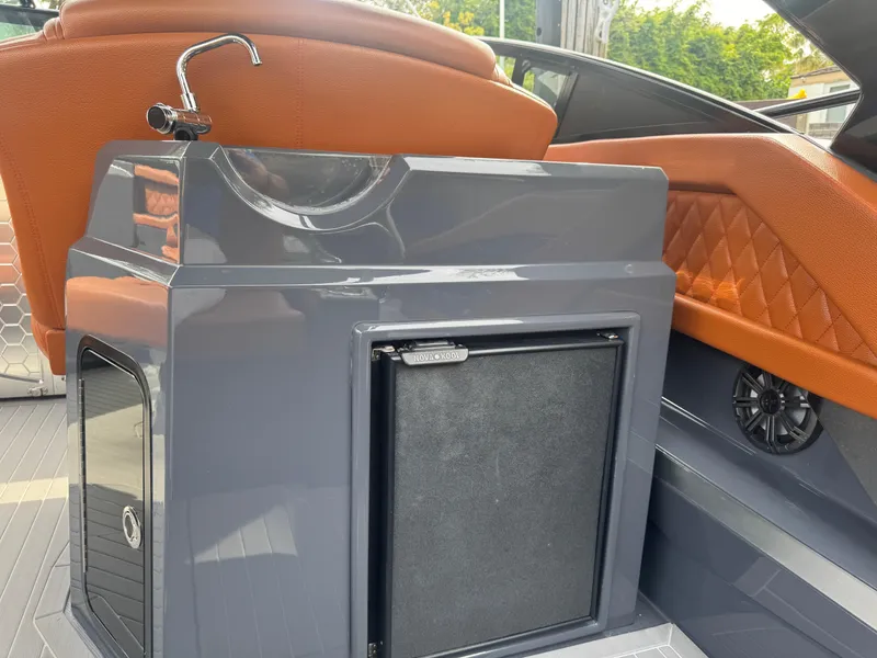 Slide: The Image of 2021 Cruisers Yachts 338 South Beach Edition Bow Rider interior with sink and storage. - 28