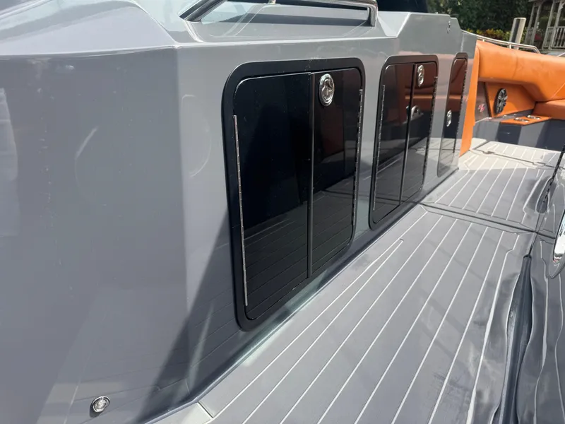 Slide: The Image of 2021 Cruisers Yachts 338 South Beach Edition Bow Rider, sleek deck and storage compartments. - 30