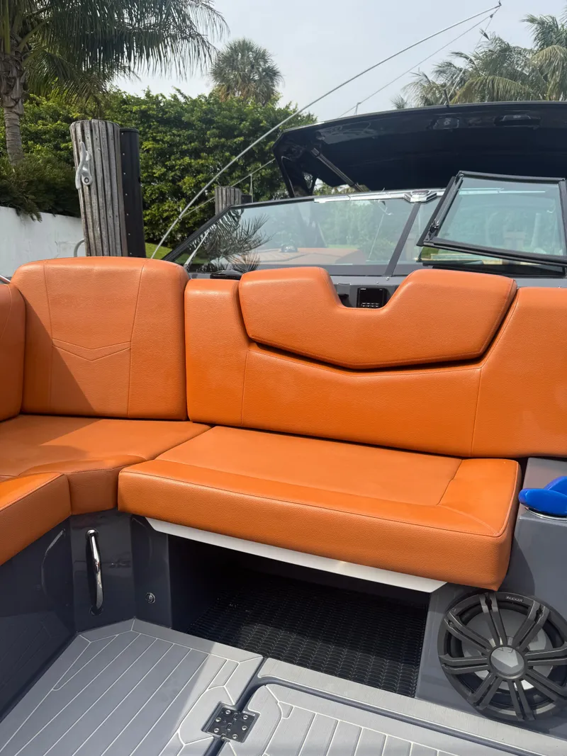 Slide: The Image of 2021 Cruisers Yachts 338 South Beach Edition Bow Rider with orange seating and sleek design. - 34