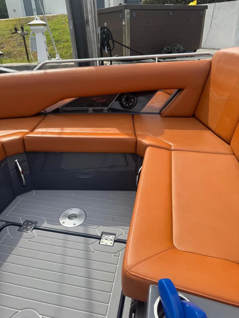 Slide: The Image of 2021 Cruisers Yachts 338 South Beach Edition Bow Rider with orange seating and sleek design. - 35
