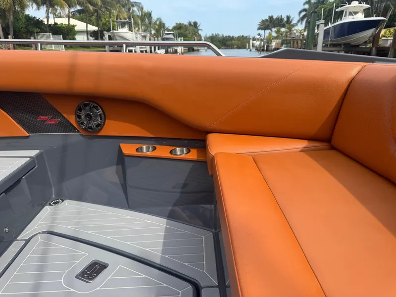 Slide: The Image of 2021 Cruisers Yachts 338 South Beach Edition Bow Rider with orange seating and sleek design. - 39