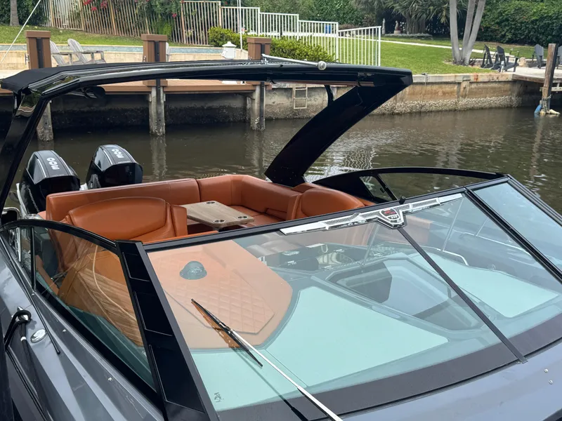 Slide: The Image of 2021 Cruisers Yachts 338 South Beach Edition Bow Rider docked by a canal. - 44