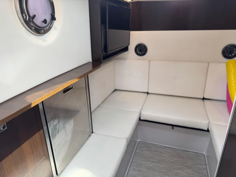 Slide: The Image of Interior of 2021 Cruisers Yachts 338 South Beach Edition Bow Rider, featuring cozy seating and modern amenities. - 46