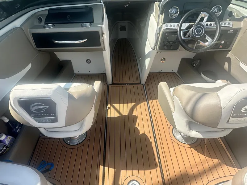 Slide: The Image of Interior of 2023 Crownline 240 SS boat with modern dashboard and seating. - 25