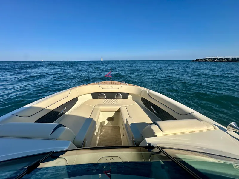 Slide: The Image of 2025 Chris-Craft Sportster 28 on open water, showcasing luxurious seating and sleek design. - 5