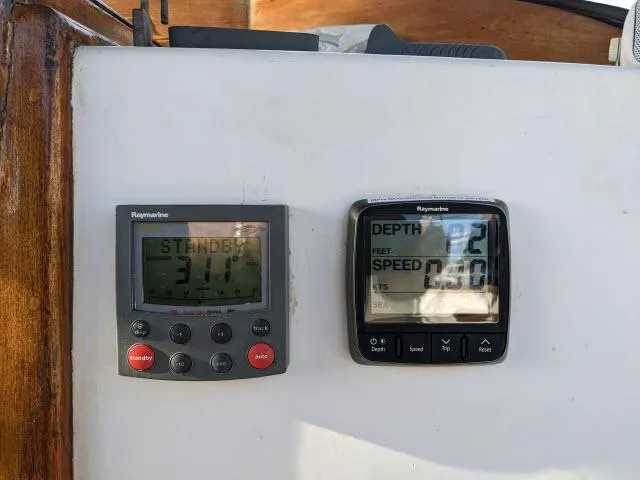 Slide: The Image of Raymarine navigation instruments on a 1981 Kelly Peterson 44 sailboat, displaying depth and speed. - 12