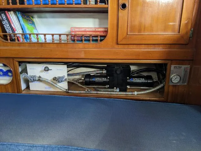 Slide: The Image of Interior of 1981 Kelly Peterson 44 yacht with water filtration system and wooden cabinetry. - 5