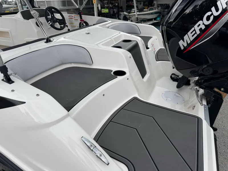 Slide: The Image of 2025 Bayliner Element M17 boat interior with Mercury engine, featuring sleek seating and modern design. - 3