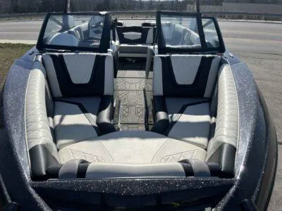 Slide: The Image of 2021 Tigé 23ZX boat interior with luxurious seating and modern design. - 7