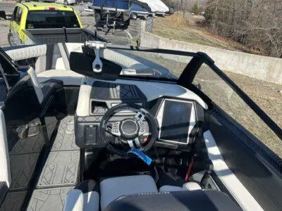 Slide: The Image of 2021 Tigé 23ZX boat interior with modern dashboard and steering wheel. - 8