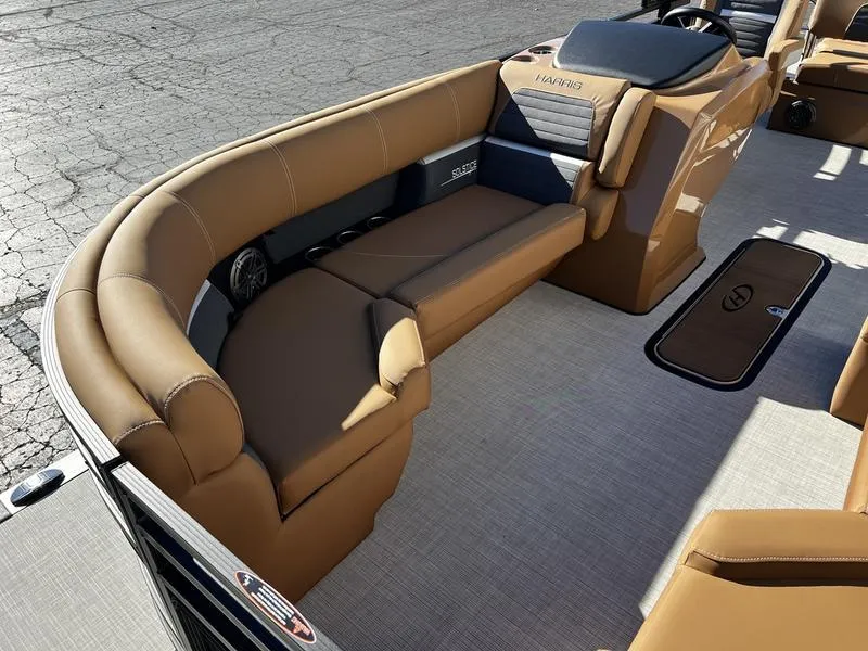 Slide: The Image of 2024 Harris Solstice 230 boat interior with tan seating and modern design. - 10