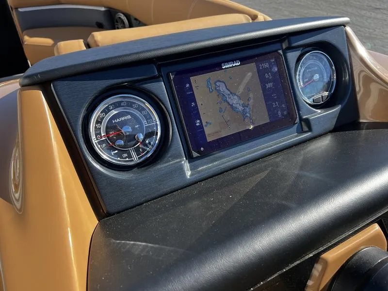 Slide: The Image of Dashboard of 2024 Harris Solstice 230 with navigation display and gauges. - 17